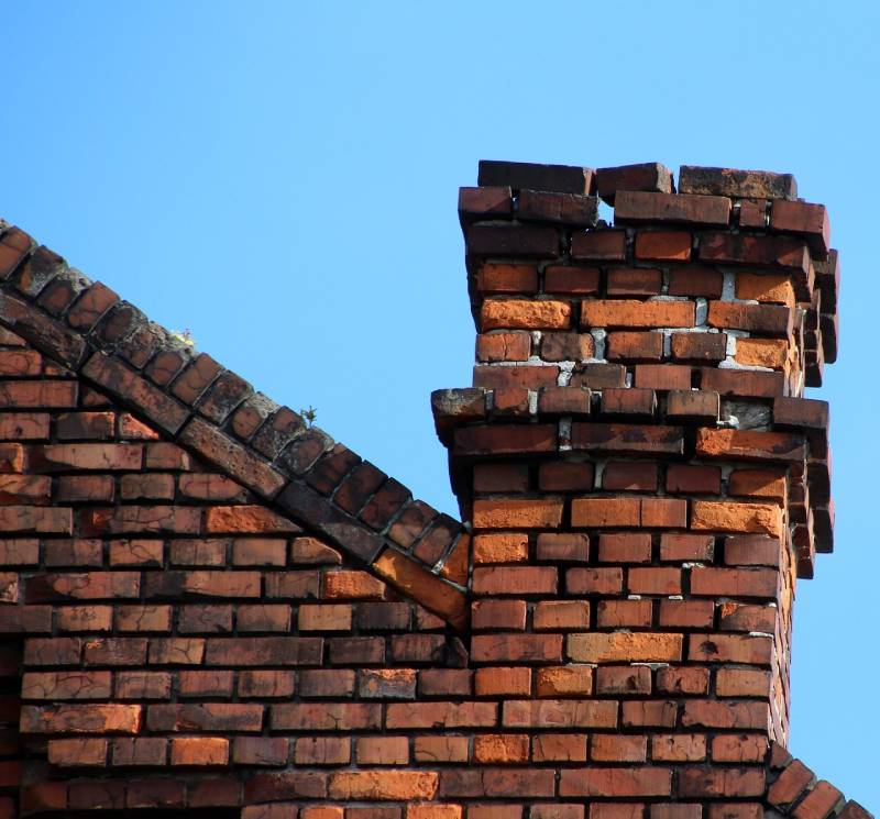 Damaged chimney on an Del Mar home showing cracks and missing mortar